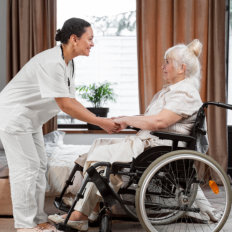 caregiver and elderly woman in a wheelchair