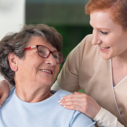 caregiver taking care of elderly