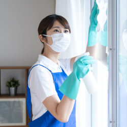 woman wiping the window