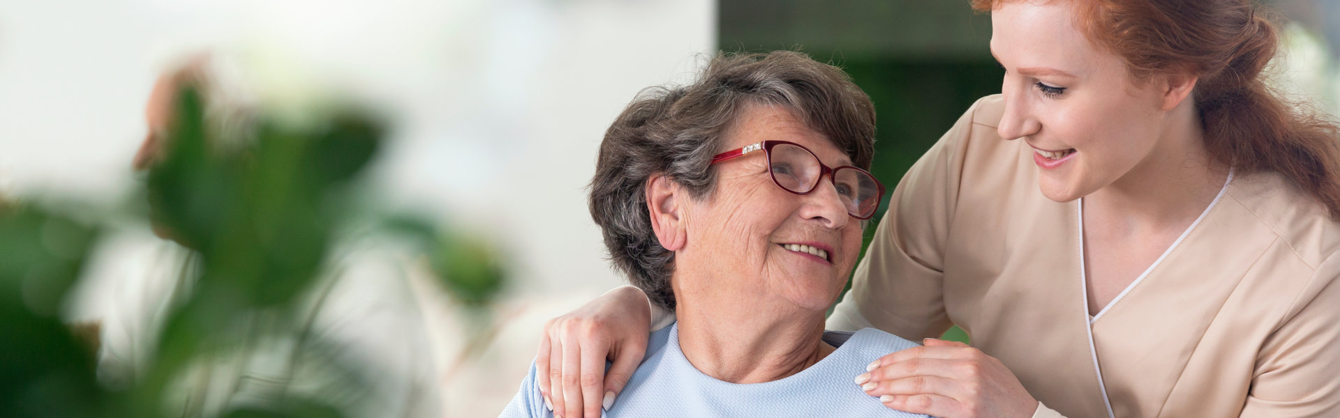 caregiver taking care of elderly